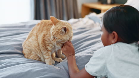 Kids,-bed-and-a-girl-petting-her-cat