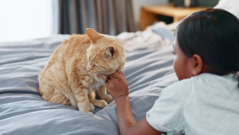 kids, bed and a girl petting her cat