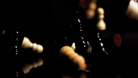 chess pieces falling