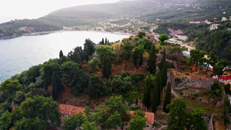 breathtaking drone view of coastal landscape with ancient fortress and turquoise sea