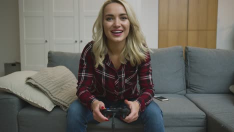 Cheerful-woman-playing-video-game