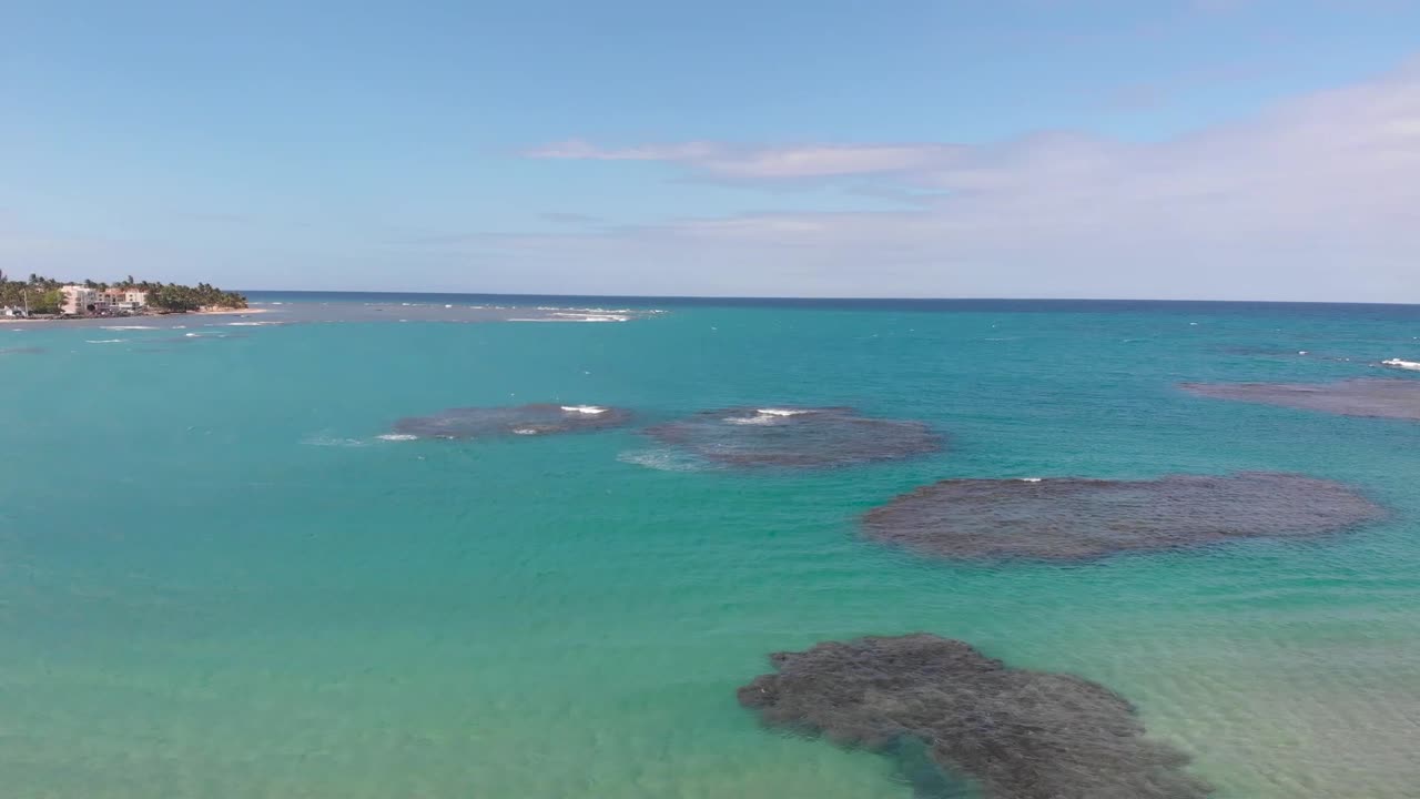 Drone shot flying forward to the beach at Puerto Rico