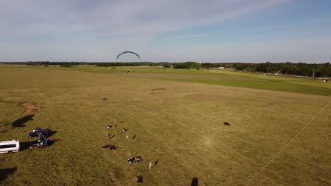 Aerial-view-of-paratrike-taking-off-from-field