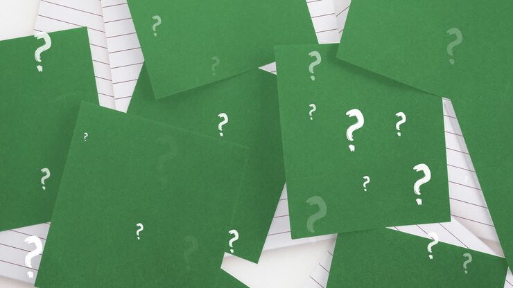 Animation of white question marks over green sheets of paper and lined notebooks