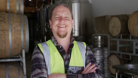 Caucasian-man-smiling-at-camera-and-wearing-high-visibility-vest