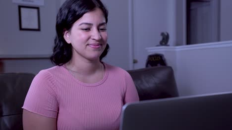 Medium-Shot-of-Beautiful-Latina-Girl-on-Laptop-remote-Smiling-Facetime-Call-With-Colleague