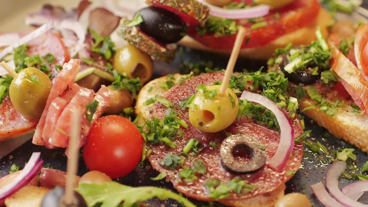 Mix of spanish pork sausages, Cutting board of appetizing catalonian snack - fuet, jamon, chorizo, olives, supermarket tapas food in spain, traditional cuisine.