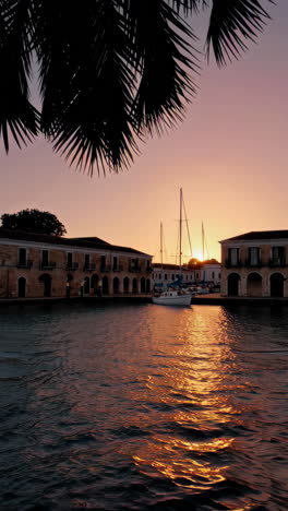 sunset over a canal in a greek harbor