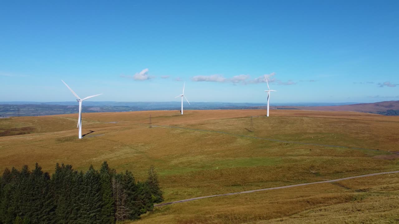 Aerial View of Wind Turbines on a Hilly Landscape