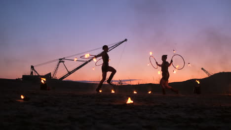 Fire-show.-A-group-of-professional-artists-performs-a-variety-of-fire-facilities.-Boys-and-girls-performed-dances-with-fire-in-the-night-on-the-street-in-the-Park