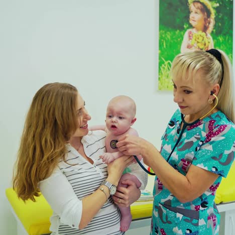 professional pediatrician examining infant