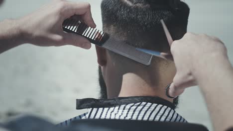 hipster hairstyle. hipster haircut. cutting hair outside. male haircut