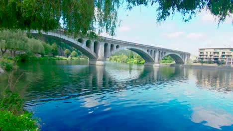 Pont-du-Chemin-de-Fer,-railway-bridge-at-Huy-on-a-sunny-summer-day,-above-The-Maas,-Huy,-Belgium,-4k,-50fps