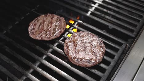 burgers grilling on a grill