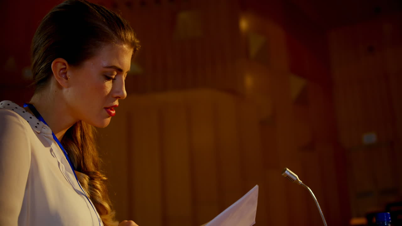 Young Caucasian businesswoman practicing speech in empty auditorium 4k