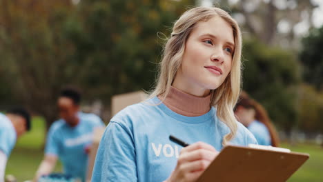 volunteer woman writing on a clipboard