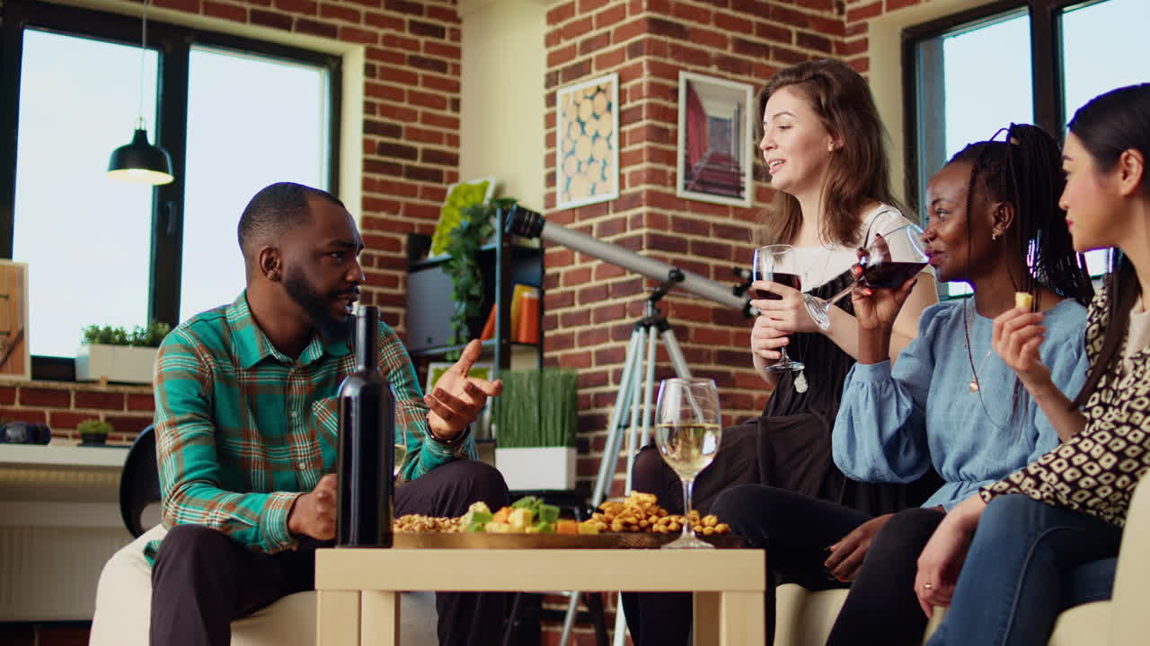 BIPOC mates enjoying social life in brick wall living room
