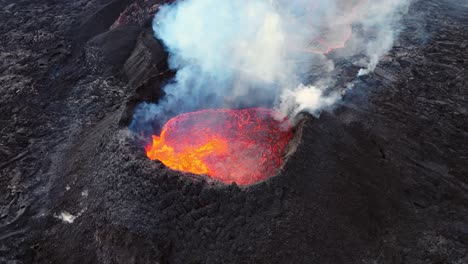 Smoking-erupting-volcano-with-red-hot-lava-in-black-volcanic-landscape