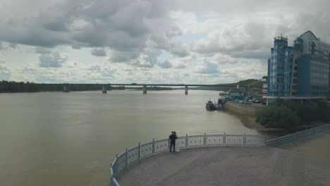 newlywed-couple-enjoys-calm-river-from-viewpoint-aerial-view