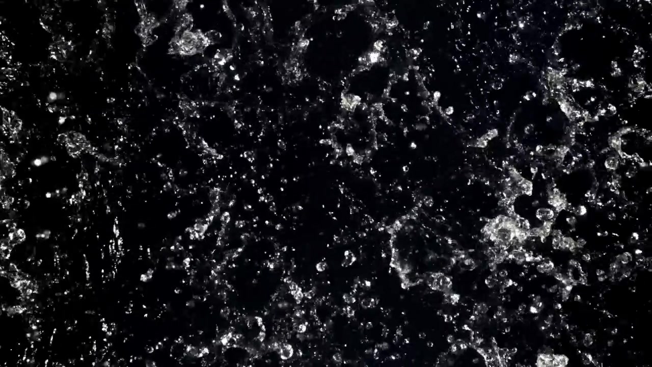 Slow Motion Water Splashing and Droplets on Black Background