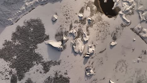 Aerial-top-view-over-ice-melting-from-Sólheimajökull-glacier,-climate-change,-global-warming,-Iceland-at-dusk