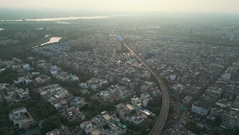 noida city and drone moving closer to metro train bird eye view noida in delhi in india