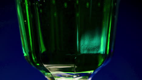 close-up of a vibrant green drink in a glass