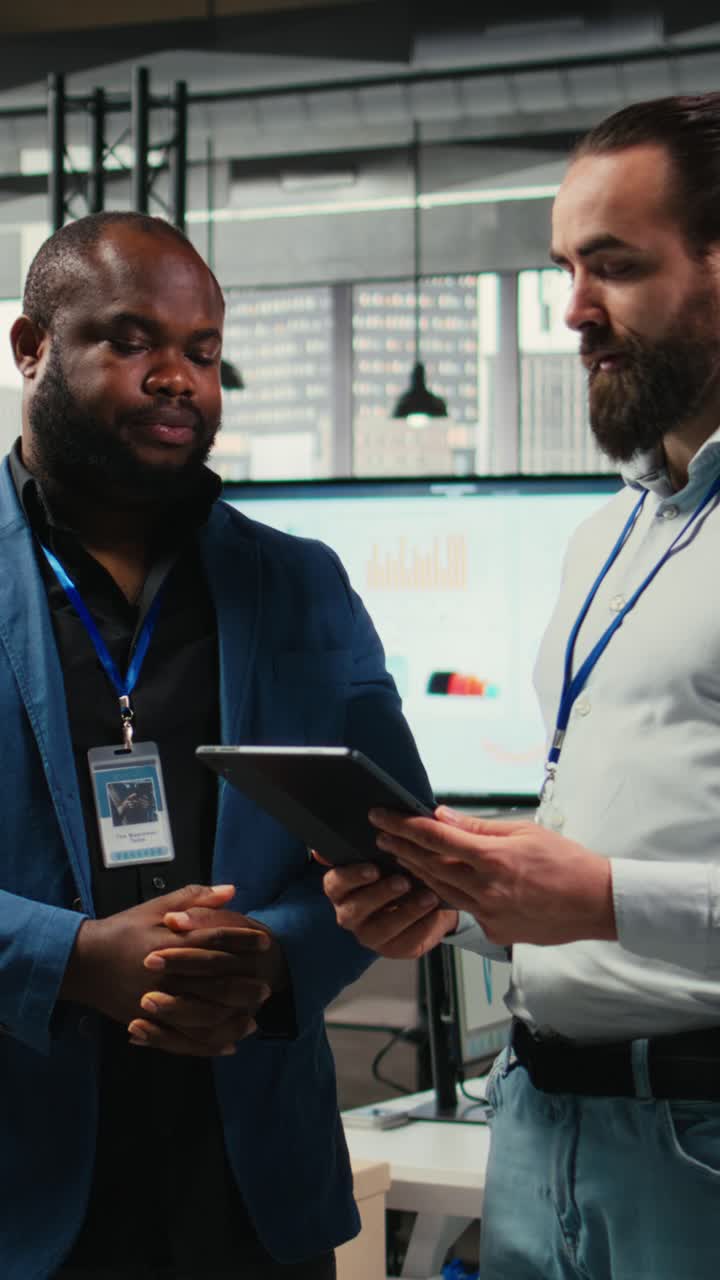 Vertical Video Businessmen analysts monitoring efficiency insights at the workspace