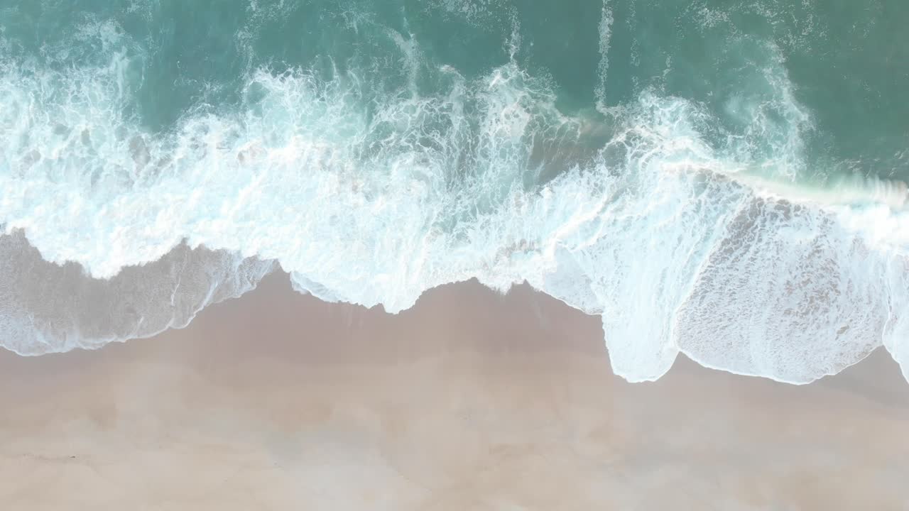 Aerial view of Tropical Beach and wave with white sand and blue sea