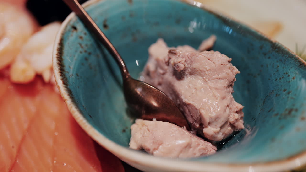 Fresh seafood platter with smoked salmon slices, shrimp, olives, and pate served with lemon and dill garnish