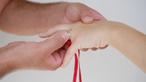 the young man wears a ring on the finger of his proposed lover. happy end.