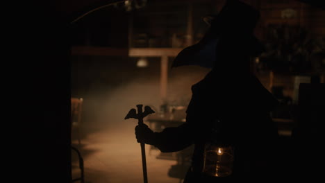 plague doctor in a dark room