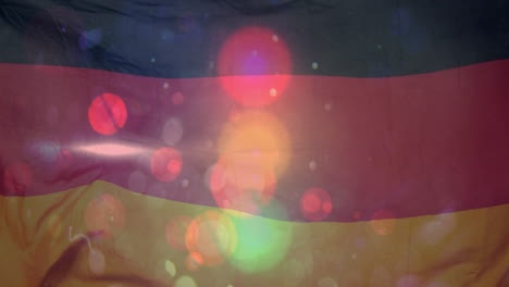 colorful light bokeh animation overlaying german flag