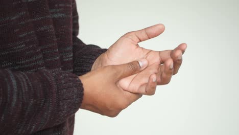 man holding his wrist in pain