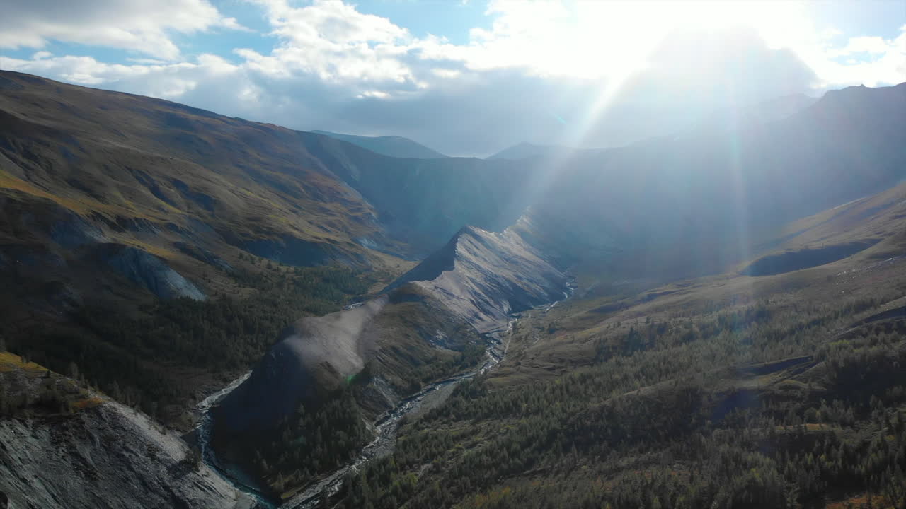 Majestic Mountain Valley with River and Sunlight