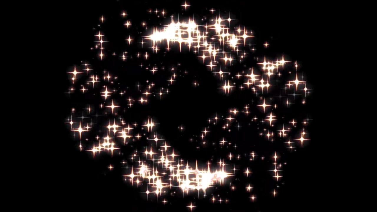 Particelle dorate luminose che formano una forma circolare su sfondo nero