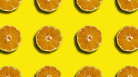 patrón geométrico mandarín en un fondo amarillo. gráficos de movimiento simples animación de frutas de la naturaleza