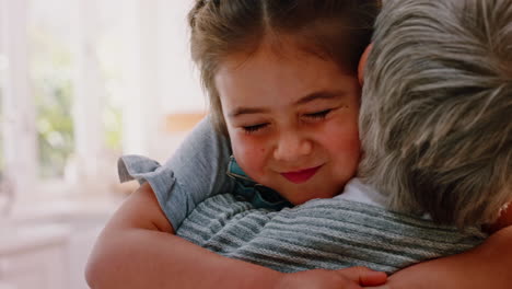 Love,-hug-and-grandmother-with-girl-in-kitchen