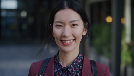 portrait happy young asian woman student smiling enjoying comfortable urban lifestyle beautiful independent female in city slow motion