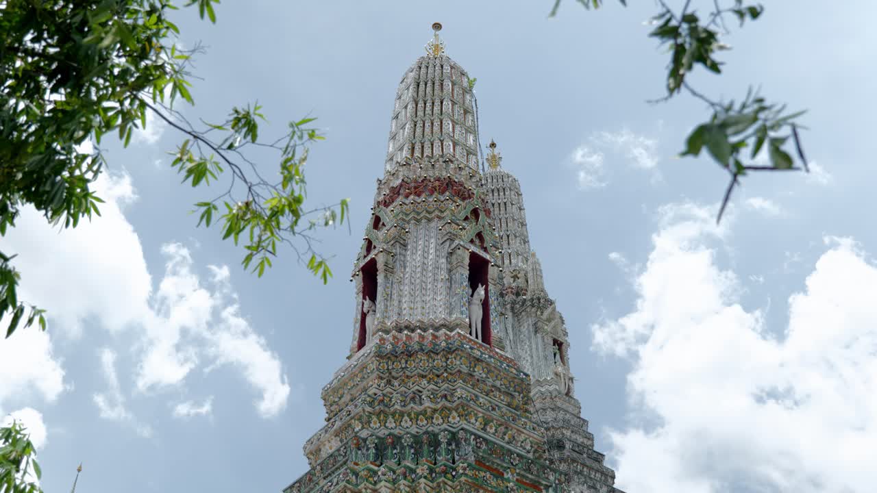 Footage of the famous Buddhist temple Wat Arun, also known as the Temple of Dawn, located on the Chao Phraya River in downtown Bangkok, Thailand