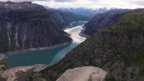 incredible establishing drone shot above famous trolltunga ledge