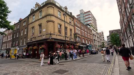 people walking on a bustling london street