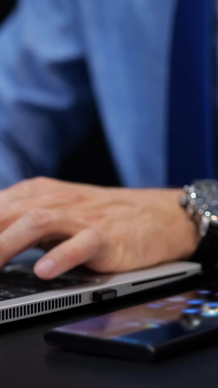 Two-factor Authentication. A Man Using A Laptop With The Verification Code Appearing As Holographic. Vertical shot