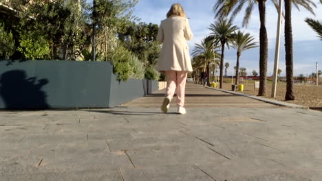 woman walking along a coastal path