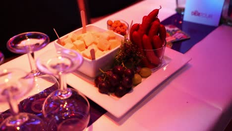 snacks and treats on a plate at an event with light rippers