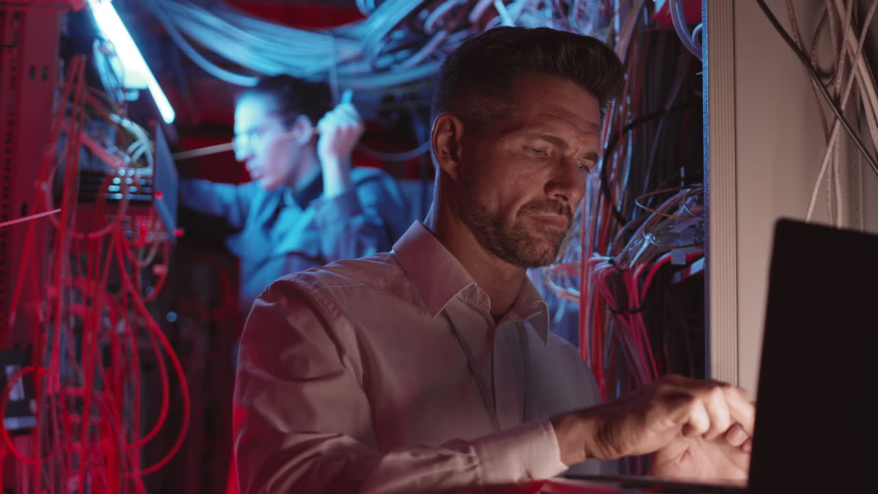 IT Professionals Working in a Server Room