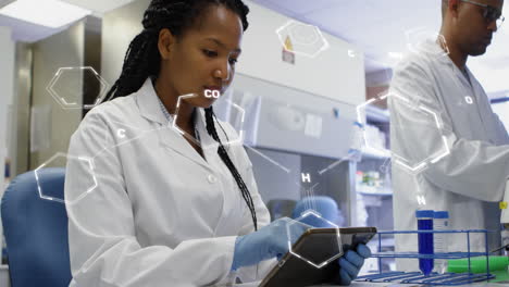 animation of medical data processing on african american female scientist using tablet at laboratory