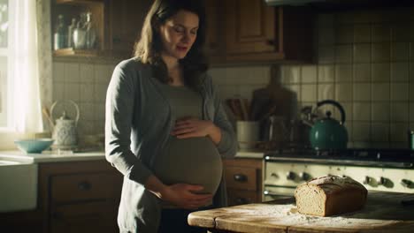 pregnant woman baking bread
