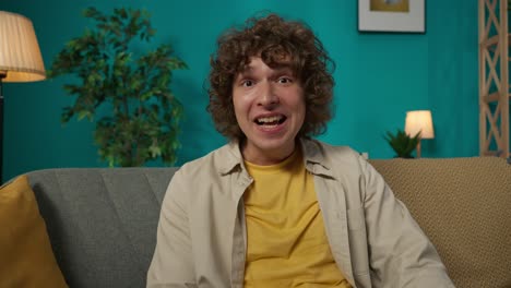 young man interacting during a video call from home