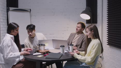 group of diverse colleagues having a team meeting in the boardroom 3